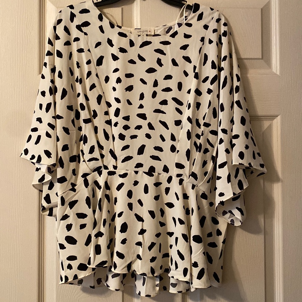 Brand new cream & black peplum top.